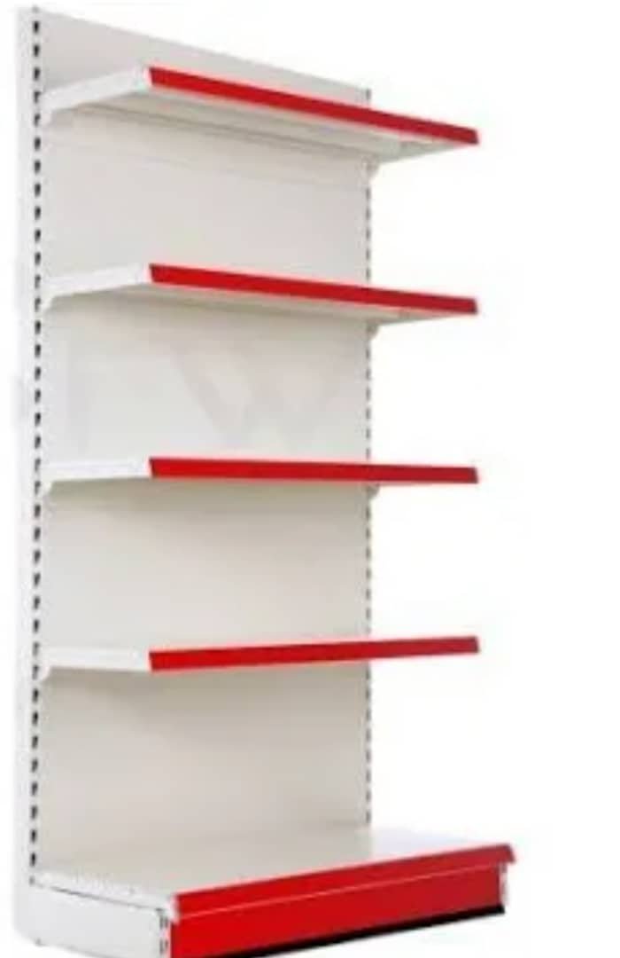 Wall shelving with red steel brackets by Sirmawax