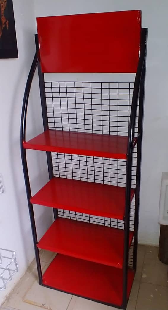 Red and black steel display rack by Sirmawax